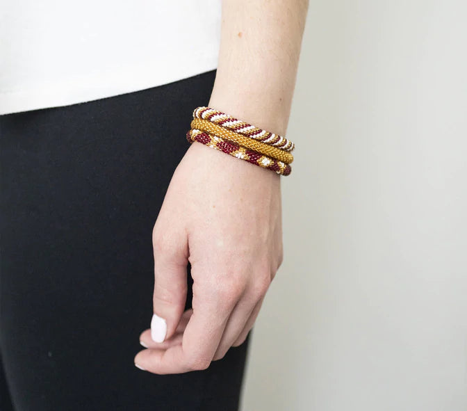 Game Day Roll-On® Bracelets Burgundy And Gold Bracelets Aid Through Trade   